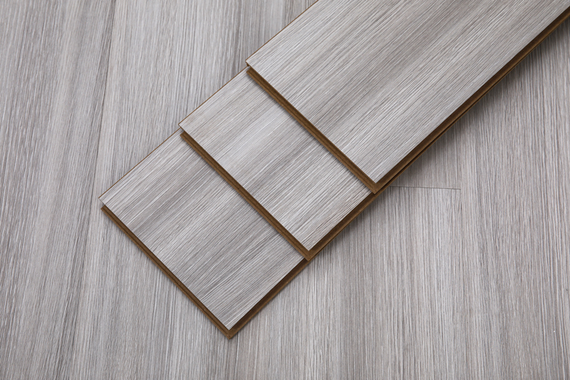 Close-up of elegant wood floors with rich grain patterns and a smooth, polished finish, highlighting natural texture and warm tones.